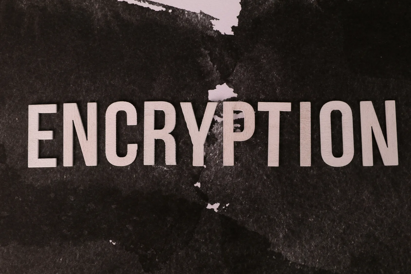 Black and white abstract image with the word 'ENCRYPTION' prominently displayed.