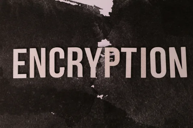 Black and white abstract image with the word 'ENCRYPTION' prominently displayed. Privacy-first measurement: measurement register template