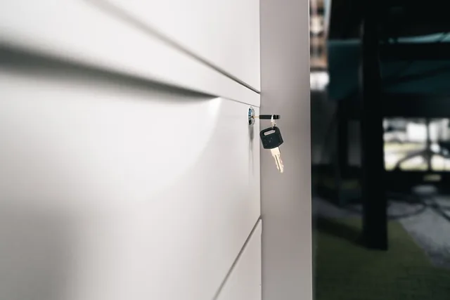 Close-up of a key in a locked office drawer for secure storage and privacy. A privacy measurement planning template, from decision record to release log