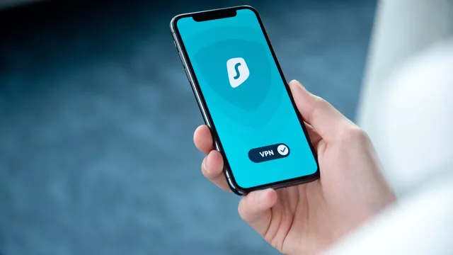 A hand holding a smartphone displaying a VPN app screen for secure online browsing. Five measurement risks to rehearse before 2027, from silent platform changes to reversed decisions